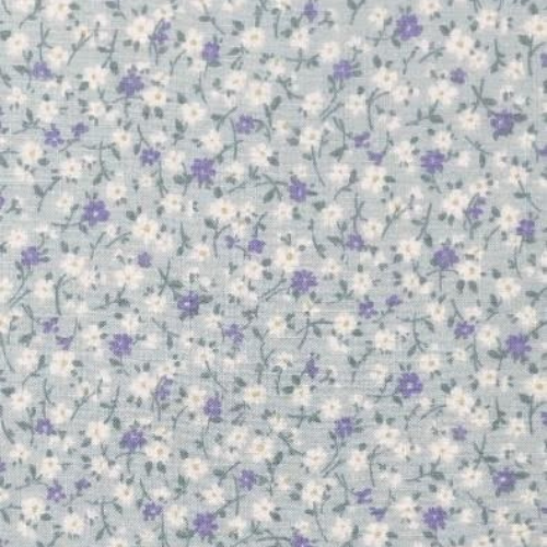 Floral pattern with small white and purple flowers on a light blue background
