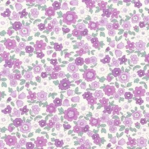 Pattern of small purple flowers on a white background