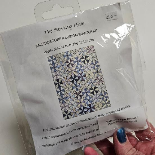 Kaleidoscope Illusion Starter Kit packaging held by a hand 
